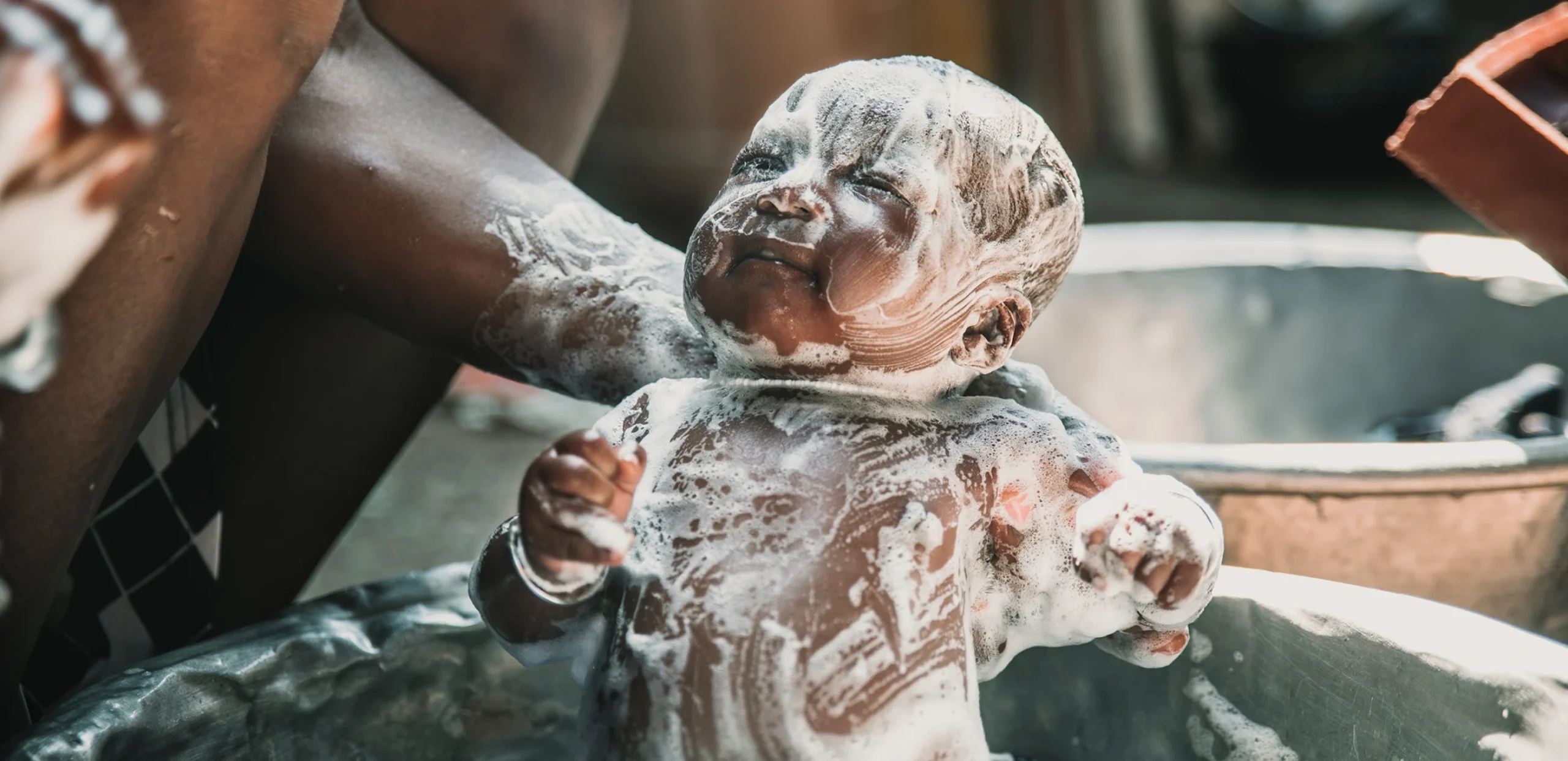 A baby getting a bath